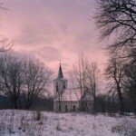 View from inside of evangelican church onto catholic church on Miedzianka market square. Both the evangelican
church and market square were completely destroyed by uranium mining works in 1950s