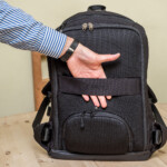 Elastic webbing on the body-facing side of the Riutbag 15.3 backpack means you can stow your backpack onto the retractable handle of a roller suitcase.